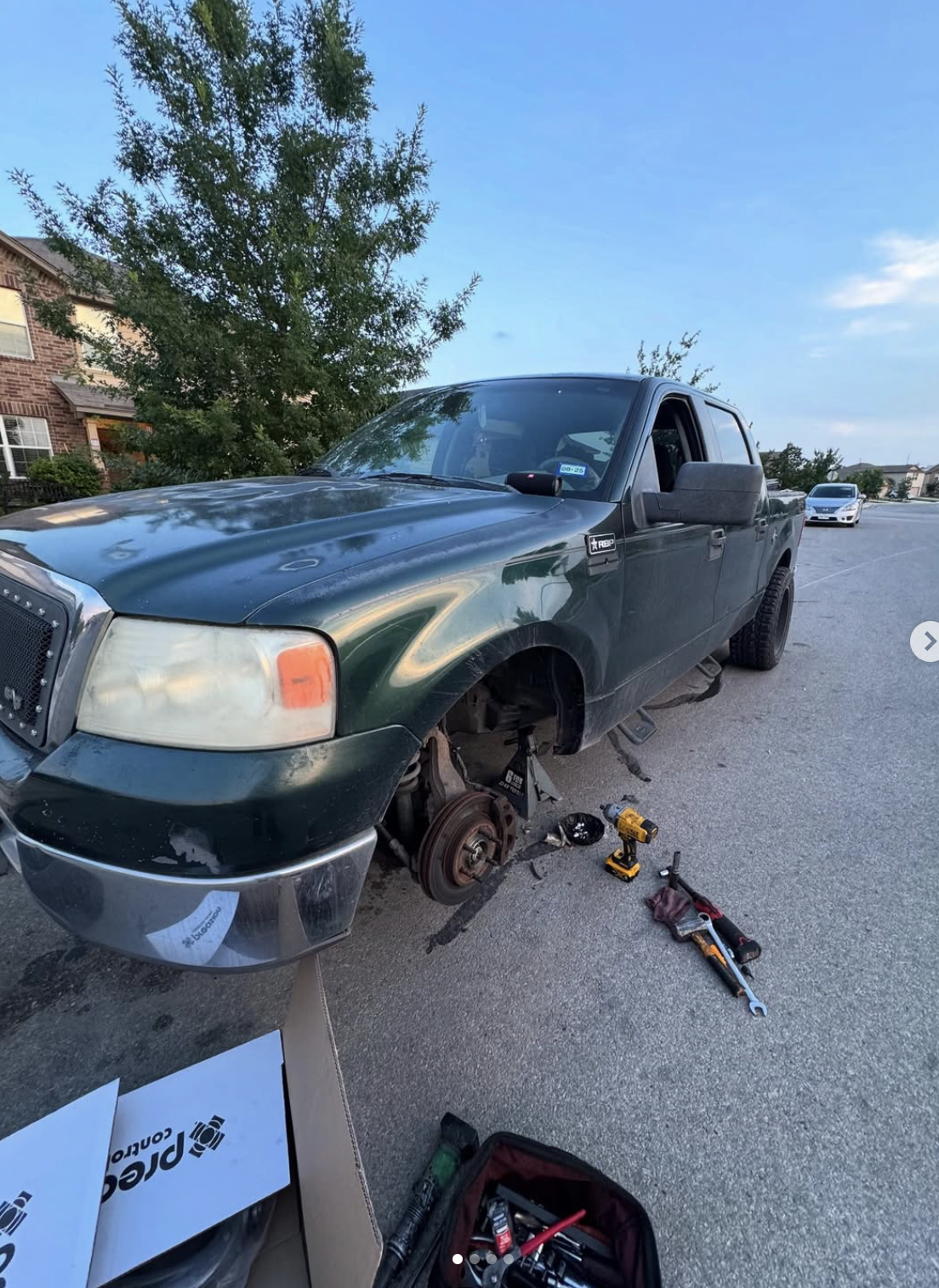 Brake and suspension job on a pickup, done in a San Antonio driveway